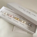 Close-up of 5 pairs of colorful pearl earrings in a Monday-Friday gift box set - 5 Pairs Pearl Studs Gift Box