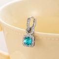 Silver drop earring featuring square teal zircon and crystal halo on ceramic rim - Light Teal