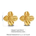 Golden stainless steel floral earrings with textured petals and center grains - Stainless Steel Four Petal Flower