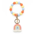 Rainbow tassel keychain bracelet with colorful silicone beads and golden metal hardware - Pink