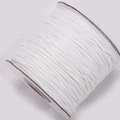 Macro detail of high-quality white waxed polyester cord spool for DIY jewelry making - White