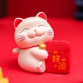 Gatto della fortuna bianco in resina con sacchetto rosso e scritte dorate fortuna - 0118 Gatto buona fortuna