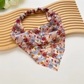 Detailed view of a floral satin headscarf with elastic band on a wooden board - Beige Floral