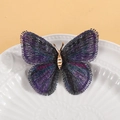 Elegante spilla a farfalla con ricamo viola e corpo metallico in tonalità dorata - Viola scuro