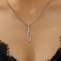 Detailed close-up of a silver punk skull pendant necklace worn by a model for Halloween - Antique Silver Small Skull Necklace (11480)