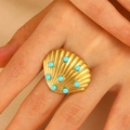 Golden seashell open ring with turquoise beads detail on a model hand - Turquoise Shell Style (2148)