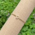 18K gold-plated beaded bracelet featuring a sparkling crystal-encrusted letter D charm - Gold D