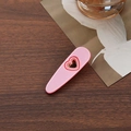 Sweet pink heart cutout hair clip with gold metal grip on wooden surface background - Heart Shape Duckbill Clip / Pink