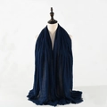 Solid navy blue crinkled cotton linen scarf with frayed edges on mannequin - Navy Blue
