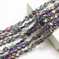Detail of 12mm iridescent purple and blue glass beads with a rhombus-shaped hole - Amethyst