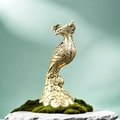 Close-up of vintage brass peacock sculpture on moss stone with detailed feathers - Brass / Peacock Standing (Phoenix Shape)