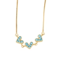 Detail of gold box chain necklace featuring three blue turquoise heart-shaped pendants - Turquoise Color