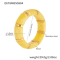 Detailed view of yellow marble resin bracelet with gold stainless steel spacers - 55mm / Yellow (E678)