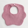 Detail of pink petal-shaped baby bib made of soft 6-layer cotton gauze with snap button - Deep Pink