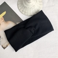 Classic black knitted twist headband with vertical ribbed texture on white background - Black
