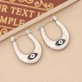 Macro view of silver U-shaped stainless steel earrings with enamel evil eye detail - 8# (Silver Large U-Shape Blue Eye)