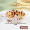 Realistic artificial cupcake model with sesame seeds in a vintage windmill paper cup - Black and White Sesame