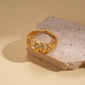 Detail of 24k gold plated geometric open ring with hollow mesh and clear zircons - Lattice Zircon Style