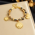 Gold leopard ribbon bracelet with sun and heart charms on a luxury jewelry box display - Leopard Print Ribbon Gold Style (B1865)