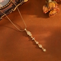 Golden Hamsa hand and heart pendant necklace with rhinestones on a snake chain - Gold Tassel Hamsa Style (T001)
