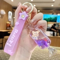 Porte-clés bonbon liquide violet mignon avec figurine d'ours et dragonne en silicone - Ours Sable Mouvant - Bonbon Au Lait / Violet