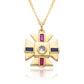 Detailed macro view of gold cross pendant with ruby and blue faceted gemstones - Vintage Cross Style (c493)