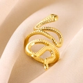 Close-up of a 18K gold snake-shaped ring with scale texture on beige silk fabric - Gold Snake Shape