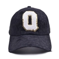 Close-up of distressed black mesh baseball cap with sequined letter Q patch embroidery - Letter Q Style (Q-漏洞马尾棒球帽)