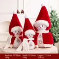 Three sizes of plush Christmas snowman dolls with red hats and white fringe scarves - Red Cloak Family of Three