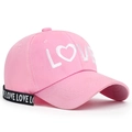 Pink baseball cap with white LOVE embroidery and black graphic ribbon strap detail - Adjustable / Pink