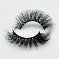 Macro shot of 20mm fluffy faux mink eyelashes with dense volume and natural messy curl - B611-20F