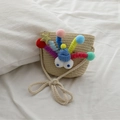 Kids mini straw crossbody bag with colorful pom-poms, big eyes, and golden stars - Beige