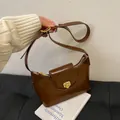 Brown glossy PU leather crescent underarm bag with gold hardware and shoulder strap - Coffee