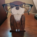 Handcrafted brown wooden otter eyeglass stand for home desk or office decor - Koala