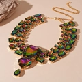 Macro detail of statement necklace with multi-color rhinestones and gold metal base - Colorful Heart Geometric Necklace