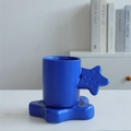Klein blue ceramic mug with fat star handle and matching star-shaped coaster set - Star Cup & Saucer - Klein Blue
