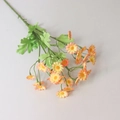 Vibrant orange artificial chamomile daisy bouquet with green leaves on white background - Orange