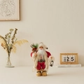 Standing Santa Claus doll in red coat with gift bag and lantern for Christmas decor - Red Backpack Style / 30cm