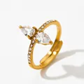 Adjustable golden stainless steel ring with pear-shaped cubic zirconia and small side stones - Gold + White Zirconia (KBJ387)