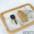 Natural 8-10cm dried spruce pine cone for DIY Christmas decoration on white snow - 8-10cm Spruce Pine Cones