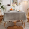 Gray checkered cotton linen tablecloth with cream tassels in a cozy home setting - Diameter 150cm (Round) / Grey Lattice with Beige Tassels