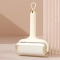 Portable lint roller in off-white with gold accents and a transparent dust cover - Creamy Yellow