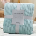 Light blue waffle weave flannel blanket folded with grey ribbon gift packaging - Light Water Blue
