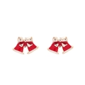 Close-up of festive red bell earrings with cream bows and golden finish accents - Bell