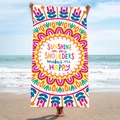 Mandala beach towel with Sunshine on my Shoulders quote held against ocean backdrop - B8-Sunshine Happiness English Phrase