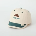 Detail view of children's beige and green baseball cap with cute dog embroidery - Style 3 Beige