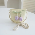 Close-up of beige woven straw bag with green bow and purple tulip floral charms - 52cm (2-5 Years) / Bag / Cream