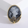 Vintage gold oval brooch with embossed queen portrait and sparkling crystal accents - Gold Base Blue