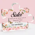 Detail of puzzle-shaped clear acrylic plaque with floral prints and gratitude message - Sister Style (Q1)