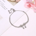 Elegant silver butterfly tennis bracelet with sparkling crystals and adjustable slider clasp - Silver Tennis Chain Bow